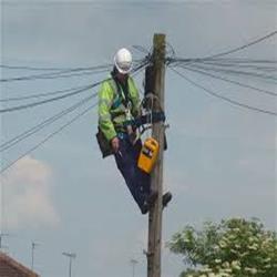 Typical UK Telegraph Pole with engineer